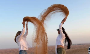 desert safari girl chucking sand