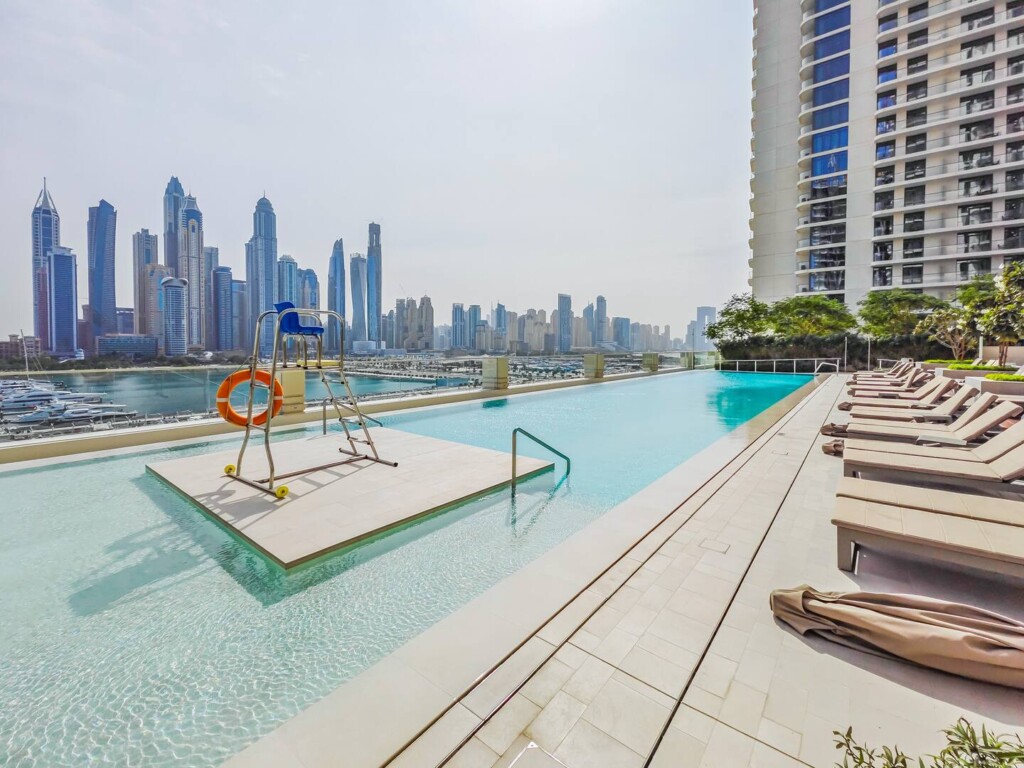 dubai skyline in front of pool