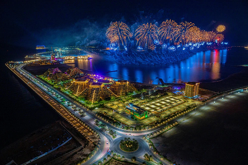 ras al khaimah at night time with fireworks